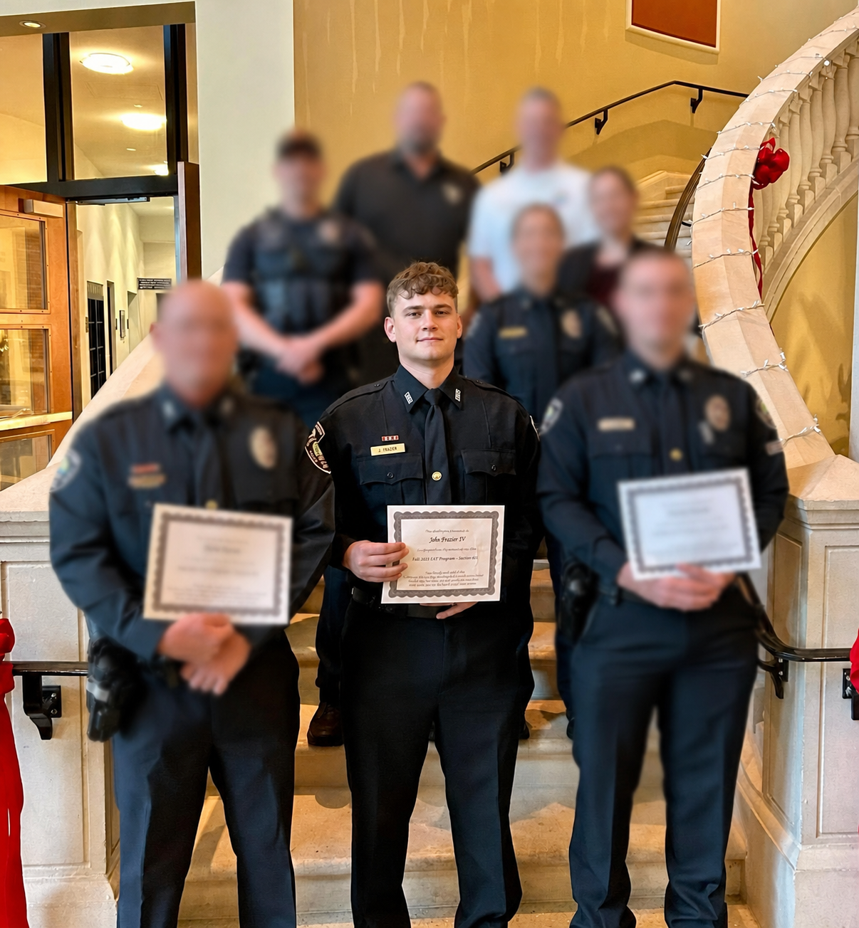 John Frazier IV pictured with other Daytona Beach Shores personnel whose identities have been blurred